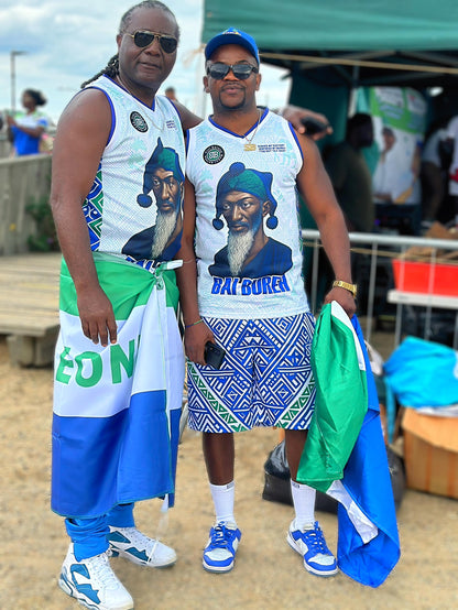 Two people wearing matching outfits with a graphic of a man and text, standing outdoors.