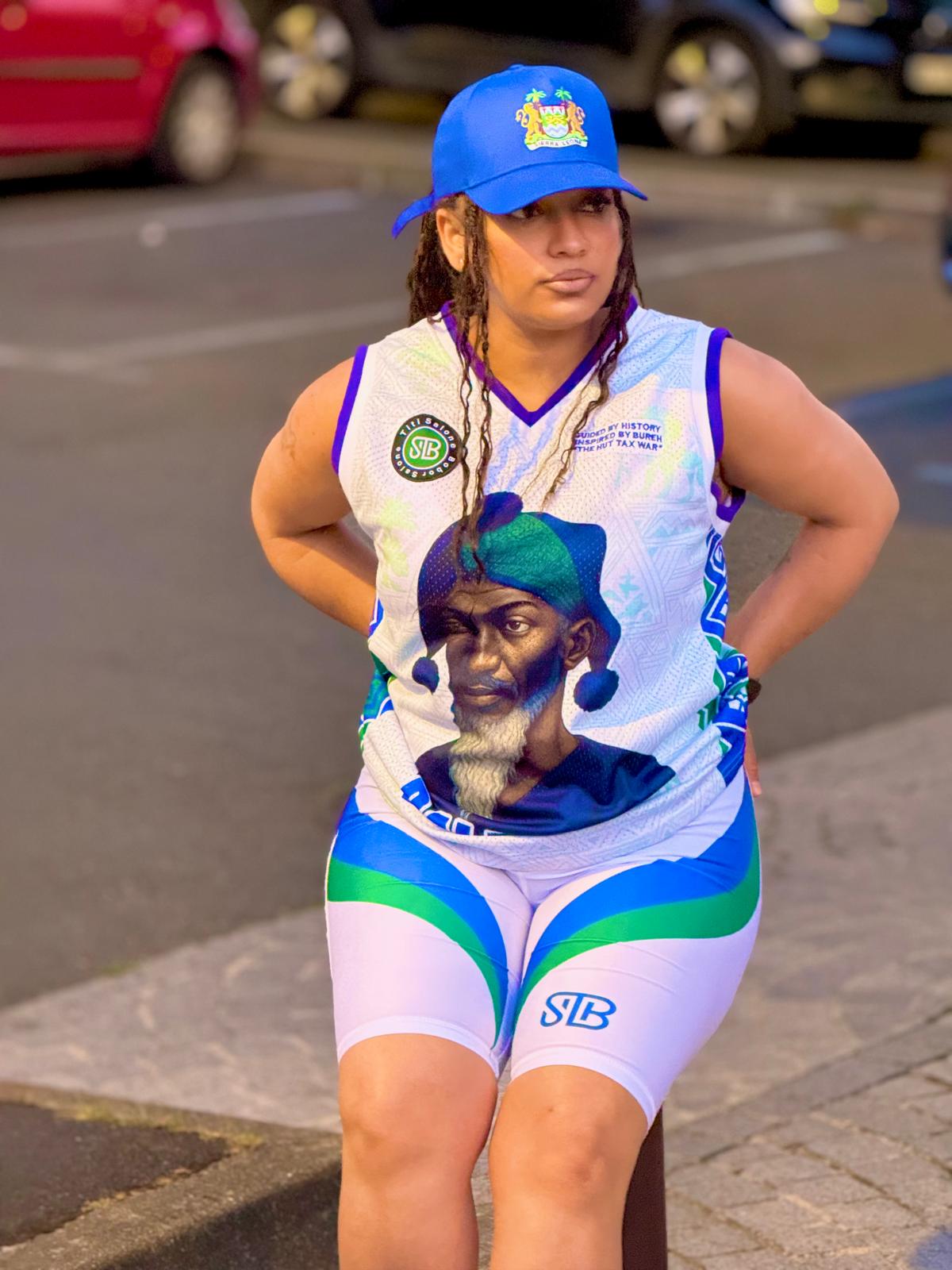 Person wearing a sports outfit with a graphic design on a street