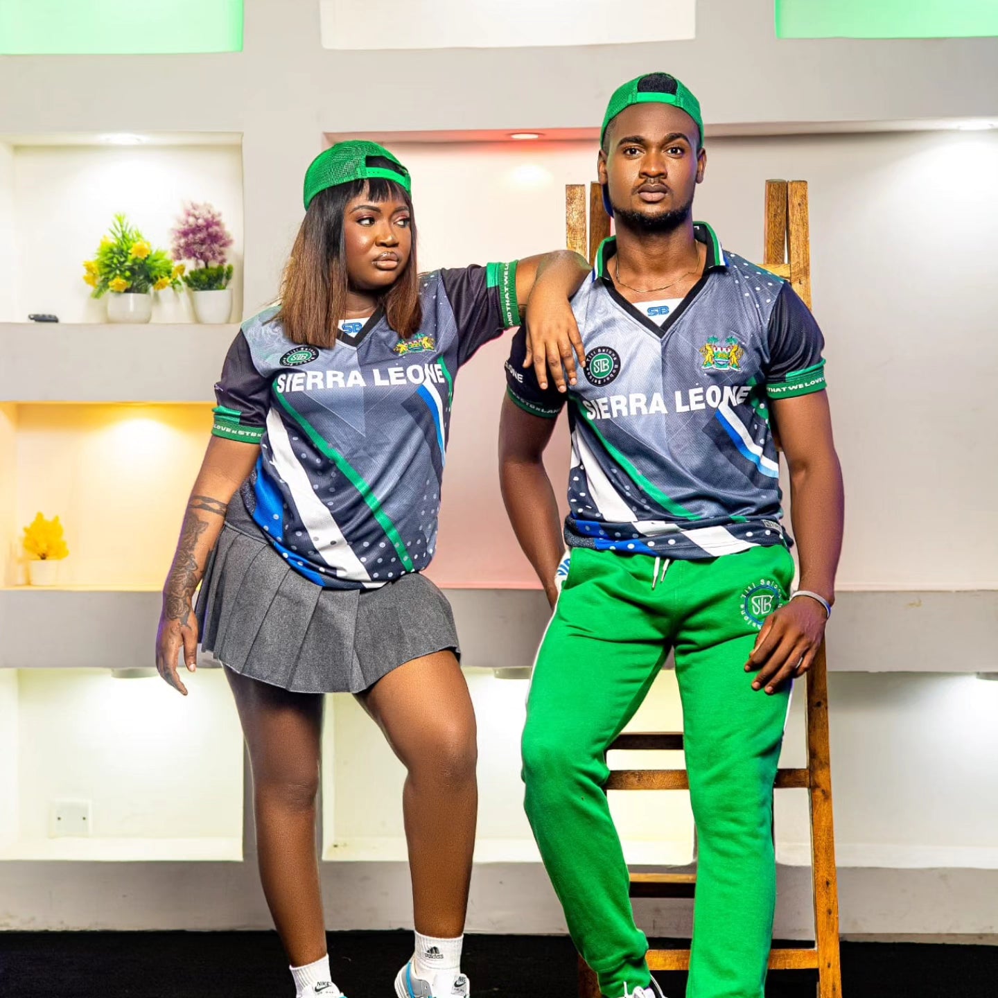 2 models wearing the Black Leopard jersey with Sierra Leone prined in front