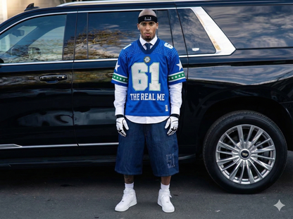 Person wearing a blue sports jersey with number 61 and text, standing in front of a black SUV.