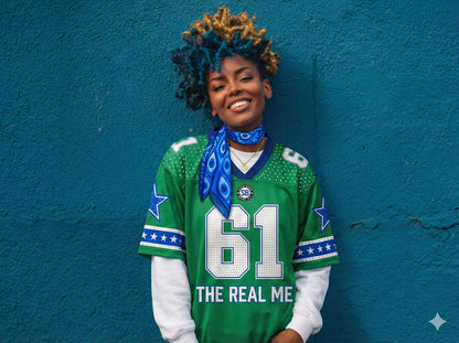 Person wearing a green sports jersey with '61 THE REAL ME' text against a blue wall