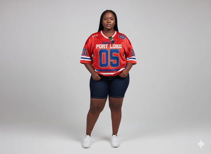 Person wearing an orange sports jersey with blue accents on a white background