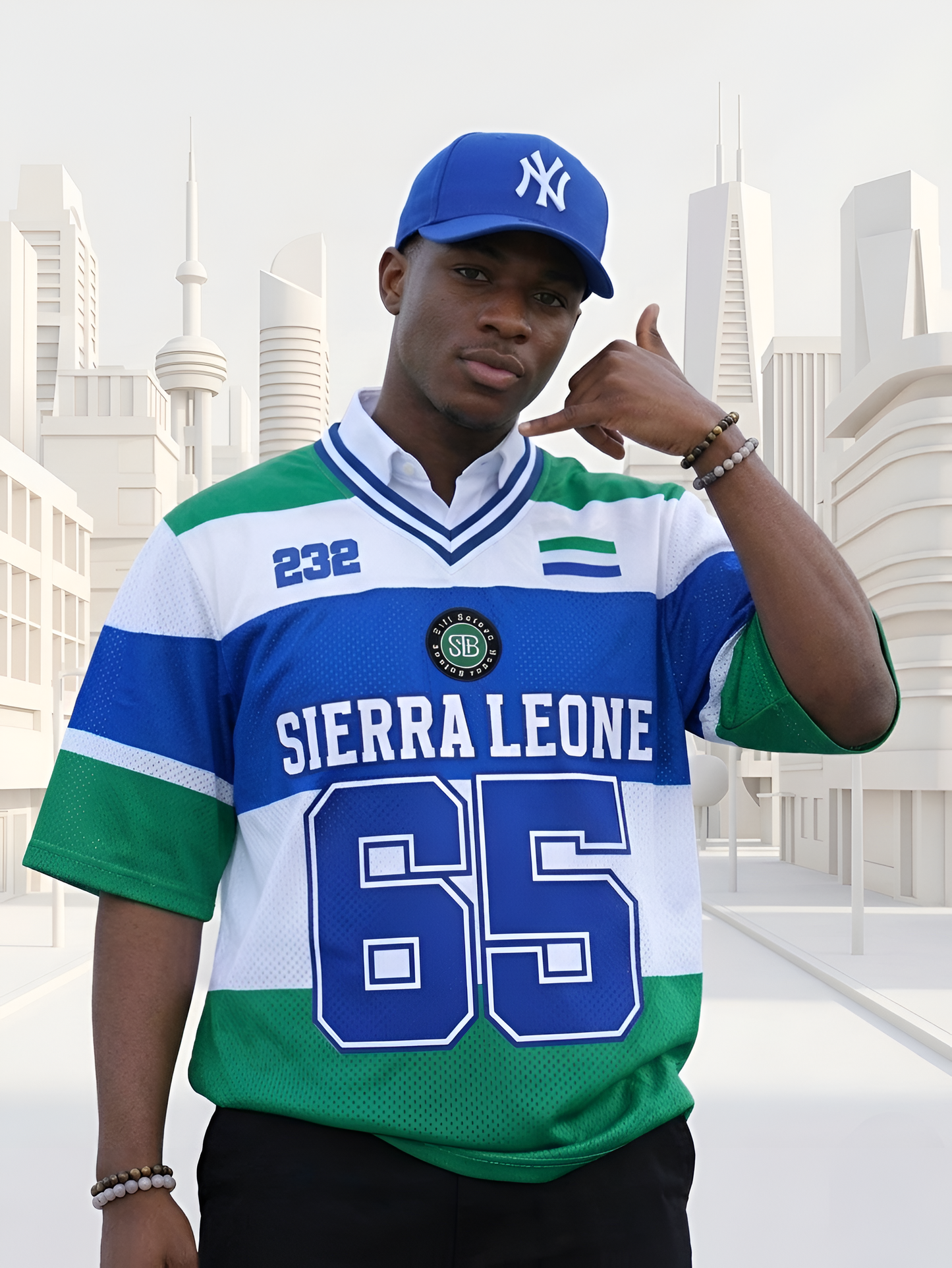 A man wearing a Sierra Leone sports jersey with a cityscape background