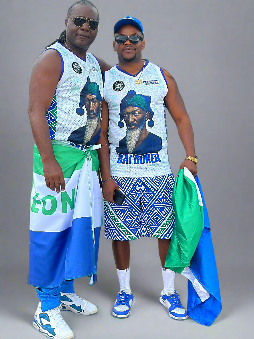 Two people wearing matching outfits with a graphic design on a gray background