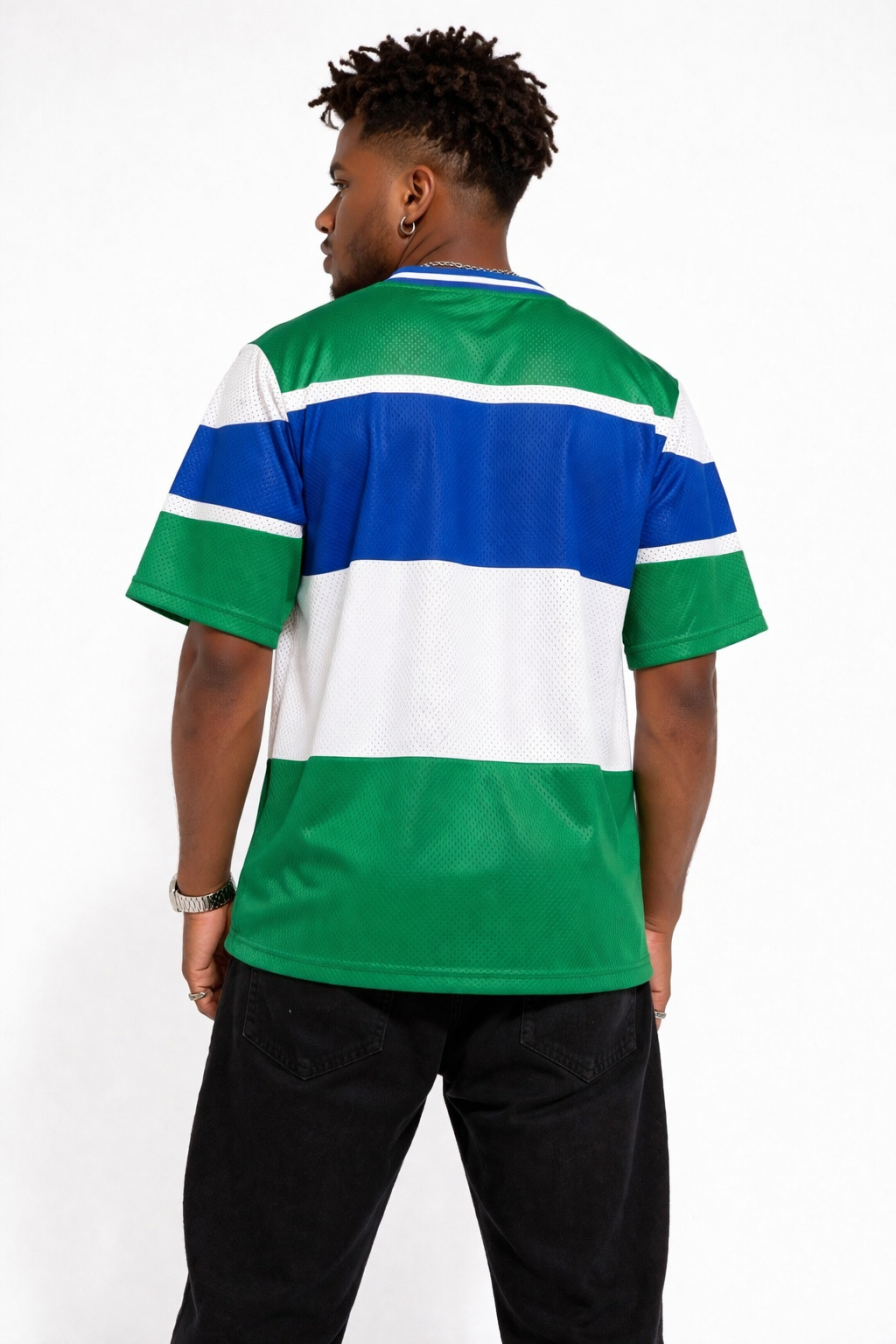 Back view of a model wearing a green, white, and blue striped shirt on a white background