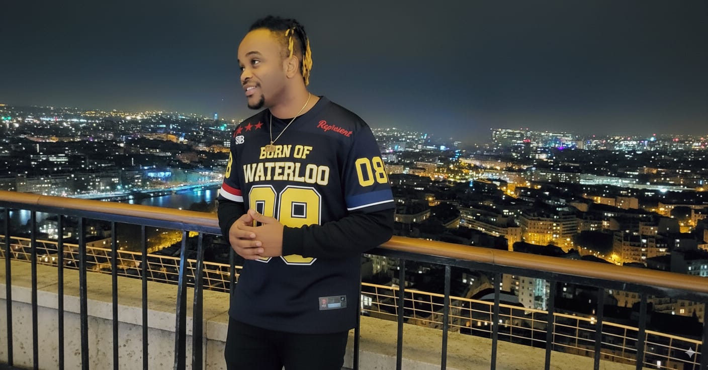 Person wearing a black and yellow sports jersey with a cityscape in the background