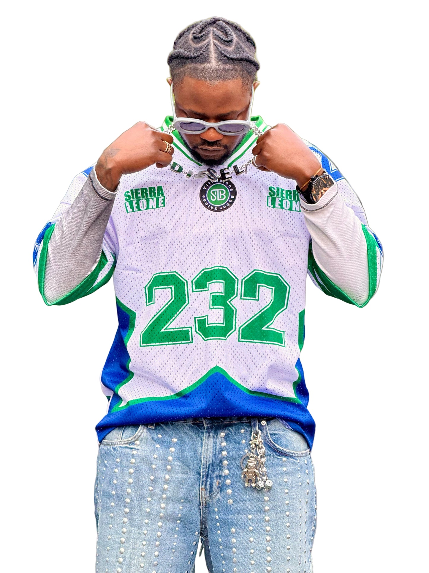 Person wearing a Sierra Leone-themed jersey with numbers in a parking lot.