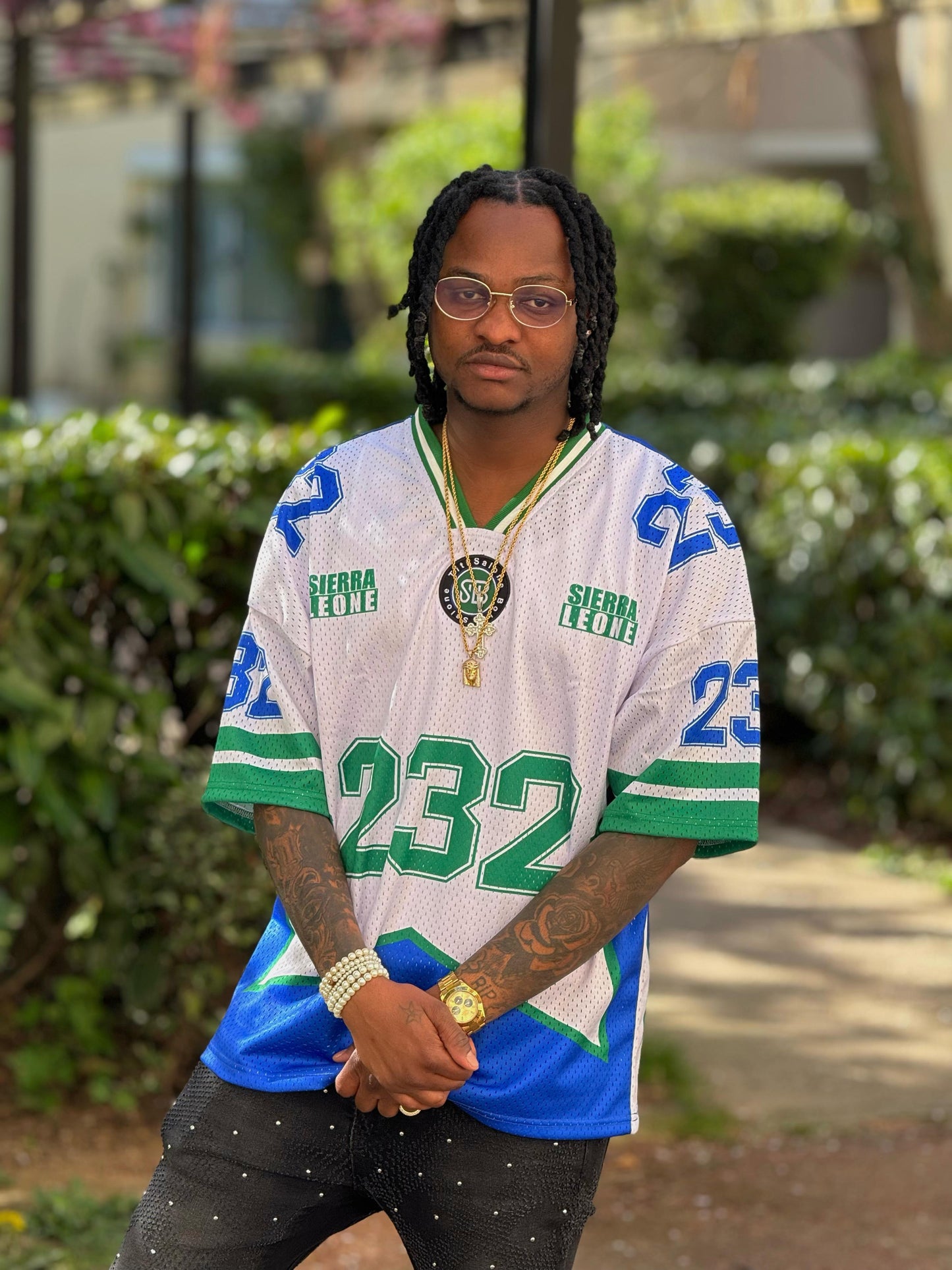 Person wearing a sports jersey with visible branding outdoors